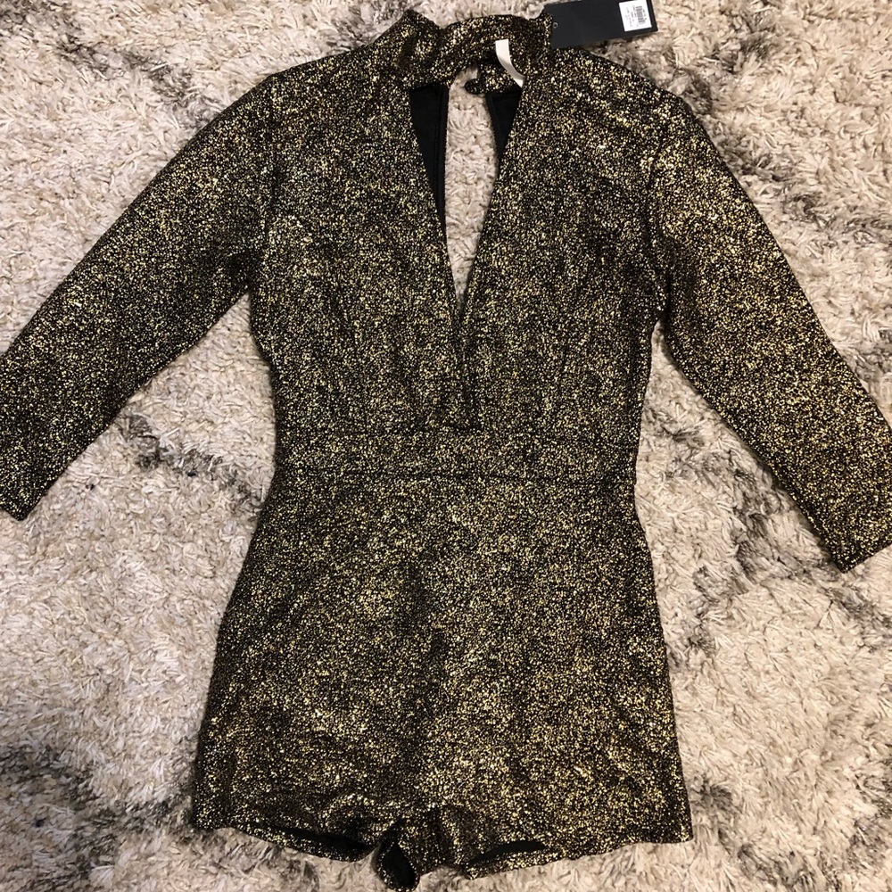 Gold and black romper with skort front